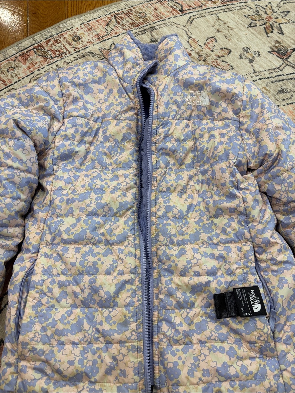 The North Face girls reversible Puffer Jacket in Light Blue & Tan Floral (10-12)